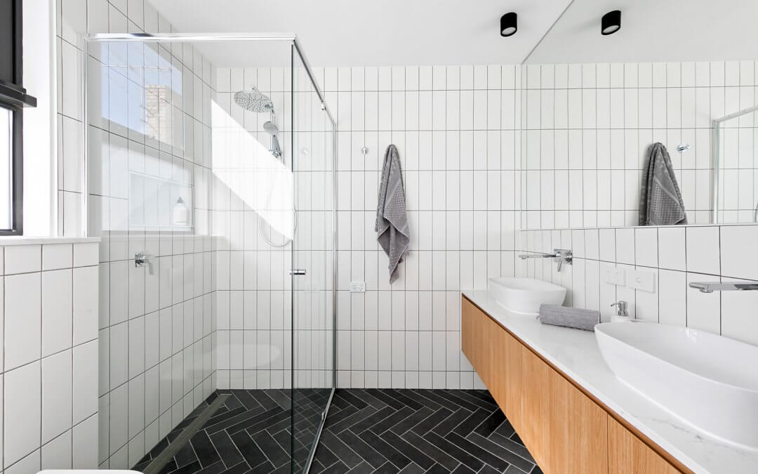 A Hotel-Inspired Bathroom with dual basins and glass shower