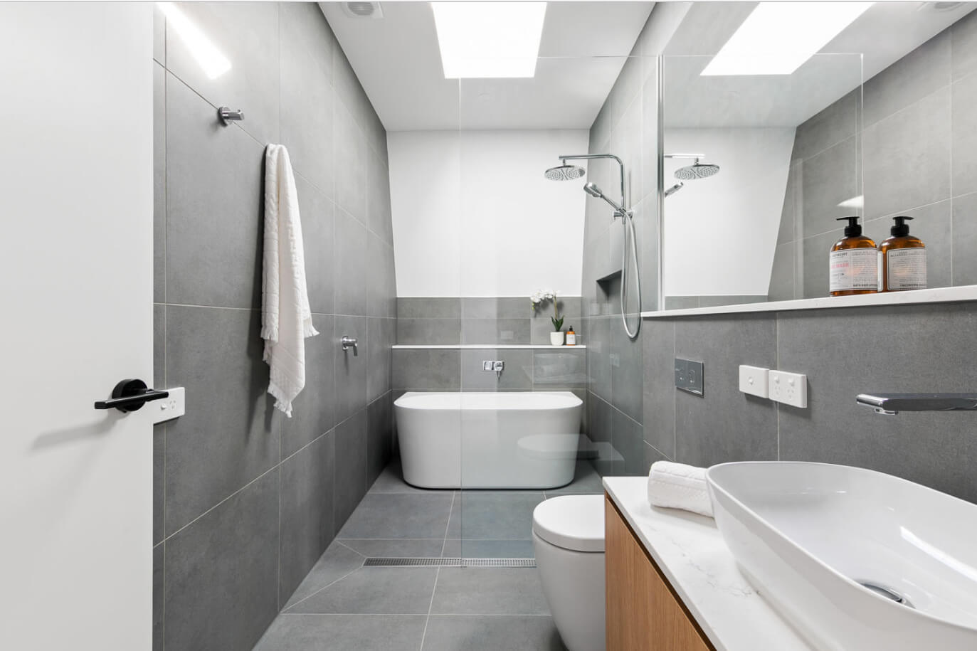 Slate gray tiled bathroom